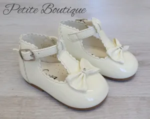 Cream patent t-bar shoes