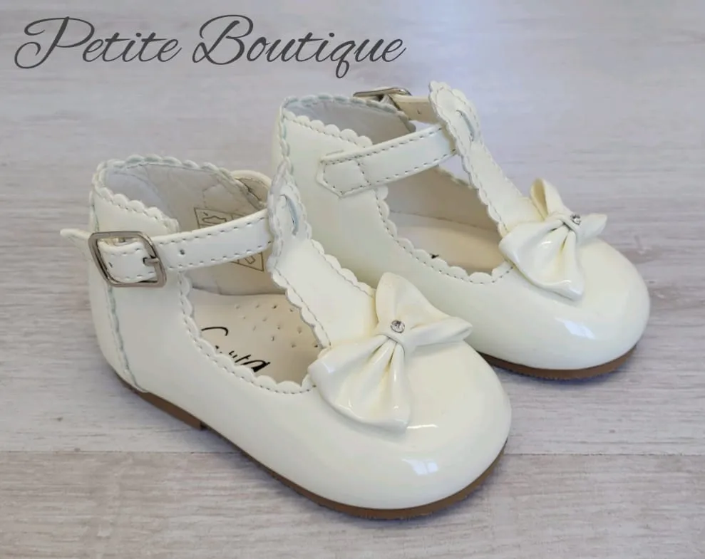 Cream patent t-bar shoes