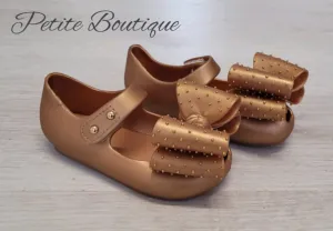 Gold bow jelly shoes