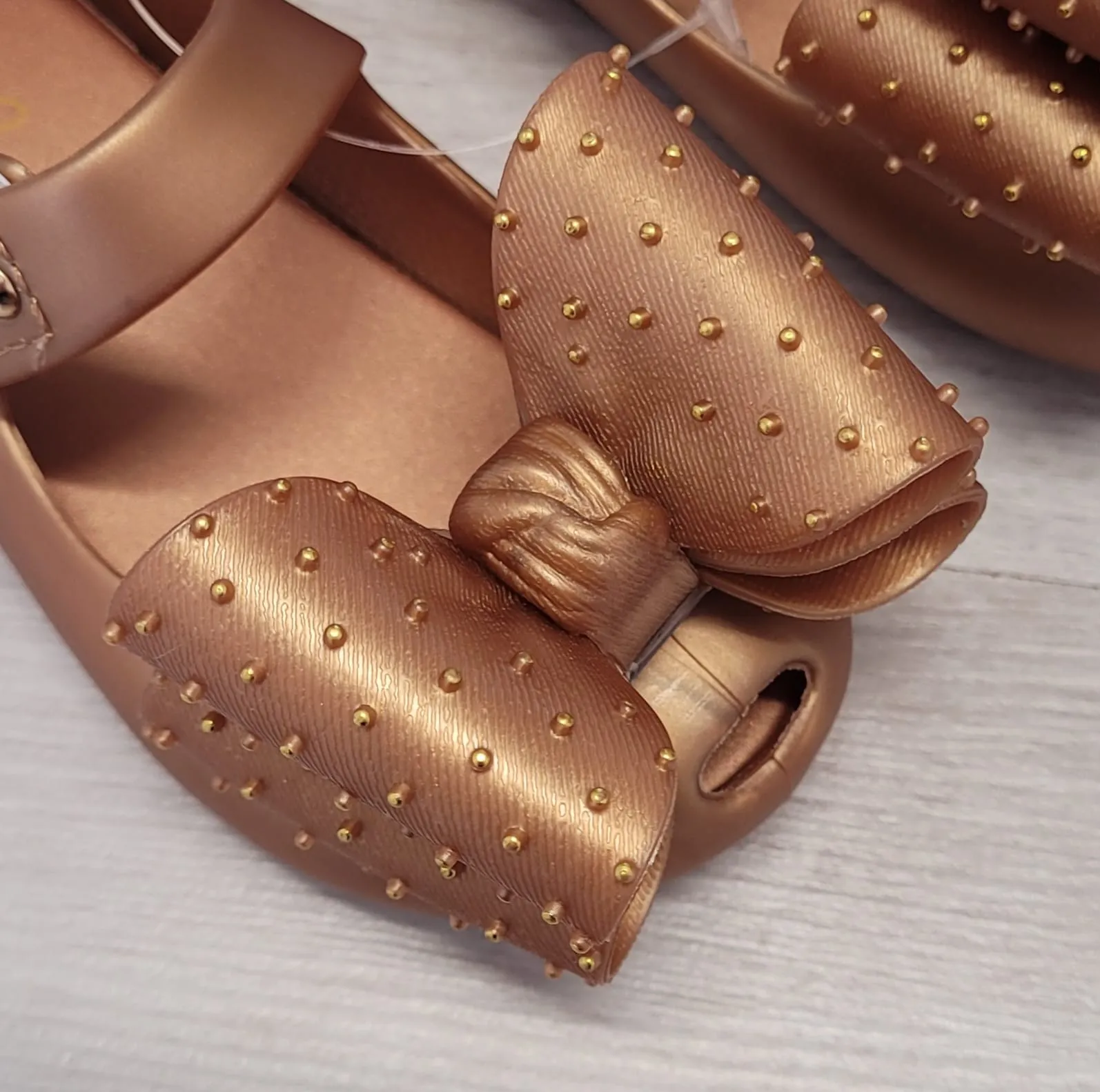 Gold bow jelly shoes