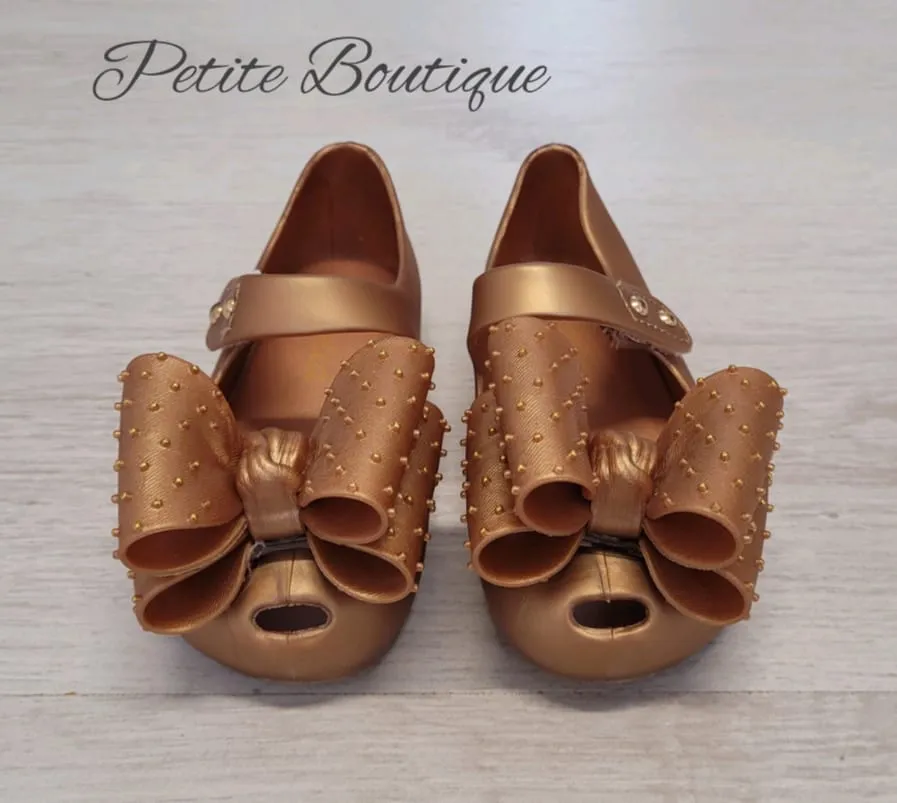 Gold bow jelly shoes