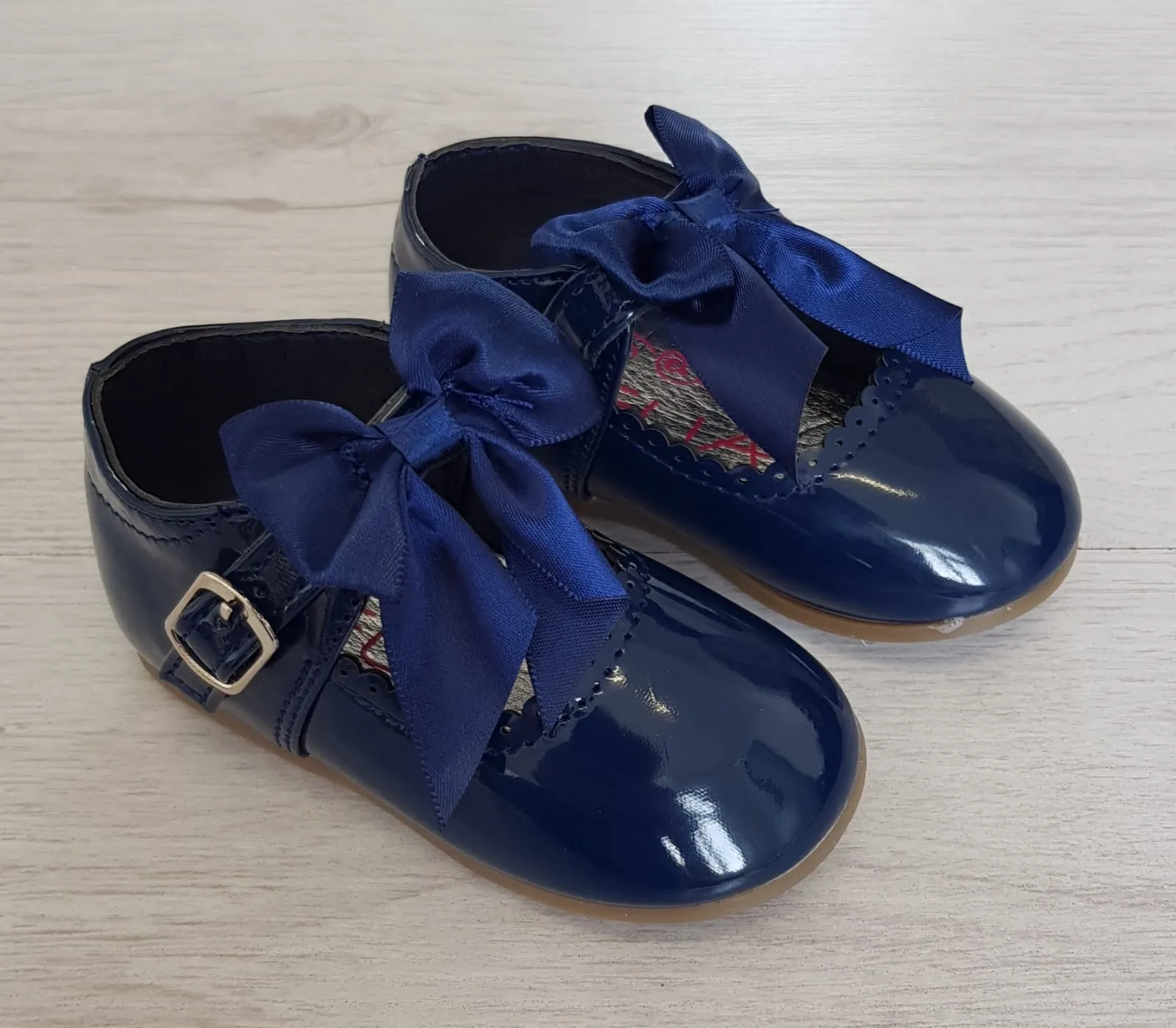 Navy patent bow shoes