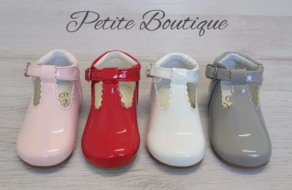 White patent t-bar shoes